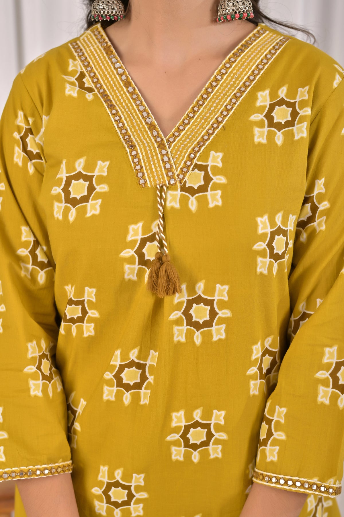 Printed Kurta Pant Set with Embroidered V-Neckline & Tassel Work